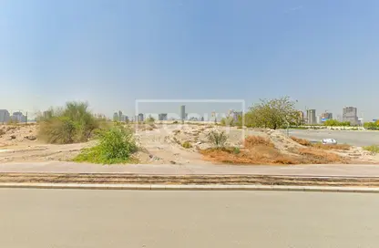 صورة لـ منظر مائي. أرض - استوديو للبيع في مدينة السيارات - دبي ، صورة رقم 1