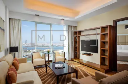 صورة لـ غرفة المعيشة النزل و الشقق الفندقية - غرفة نوم - 1 حمام للايجار في مدينة دبي للانترنت - دبي ، صورة رقم 1