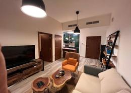 Living Room image for: Apartment - 1 bedroom - 2 bathrooms for sale in Madison Residences - Majan - Dubai, Image 1