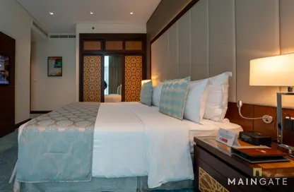 Room / Bedroom image for: Apartment - 1 Bedroom - 2 Bathrooms for rent in Royal Continental Suites - Business Bay - Dubai, Image 1