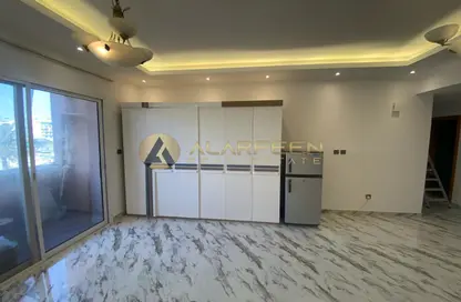 صورة لـ مطبخ شقة - غرفة نوم - 3 حمامات للبيع في ماغنوليا 2 - حدائق الإمارات 2 - قرية الجميرا سركل - دبي ، صورة رقم 1