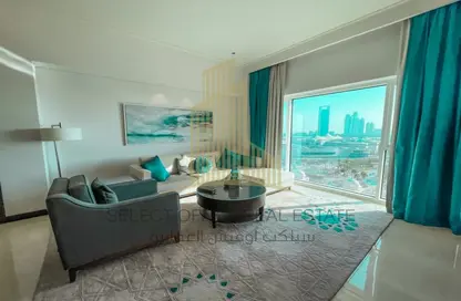 Living Room image for: Apartment - 1 Bedroom - 2 Bathrooms for sale in Fairmont Marina Residences - The Marina - Abu Dhabi, Image 1