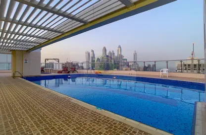صورة لـ حوض سباحة شقة - غرفة نوم - 2 حمامات للايجار في جنة الوليد - بحيرة إلوشيو - أبراج بحيرة الجميرا - دبي ، صورة رقم 1