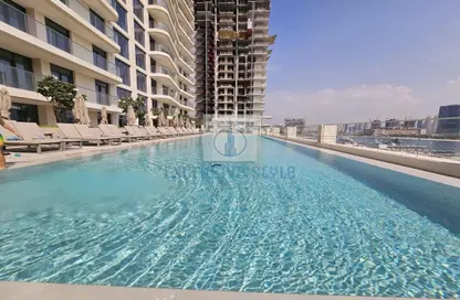 Pool image for: Apartment - 1 Bedroom - 2 Bathrooms for sale in Marina Vista - EMAAR Beachfront - Dubai Harbour - Dubai, Image 1