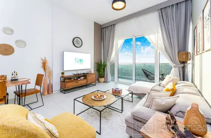 Living / Dining Room image for: Apartment - 1 Bedroom - 2 Bathrooms for rent in 1 Residences - 2 - Wasl1 - Al Kifaf - Dubai, Image 1