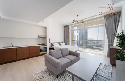 Living Room image for: Apartment - 1 Bathroom for rent in Hameni Tower - Jumeirah Village Circle - Dubai, Image 1