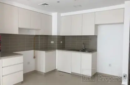 Kitchen image for: Apartment - 2 Bedrooms - 2 Bathrooms for sale in Hayat Boulevard-1A - Hayat Boulevard - Town Square - Dubai, Image 1