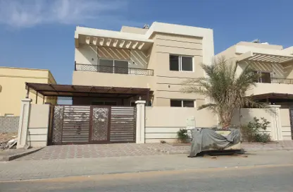 Outdoor Building image for: Villa - 5 Bedrooms - 7 Bathrooms for sale in Ajman Global City - Al Alia - Ajman, Image 1