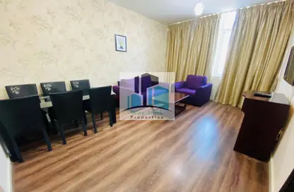Living / Dining Room image for: Apartment - 1 Bedroom - 2 Bathrooms for rent in Al Hazem Tower - Al Nahyan - Abu Dhabi, Image 1