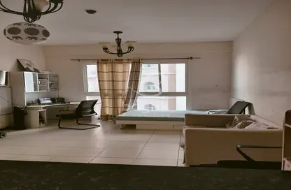 Living Room image for: Apartment - 1 Bedroom - 1 Bathroom for sale in Indigo Spectrum 2 - Indigo Towers - International City - Dubai, Image 1