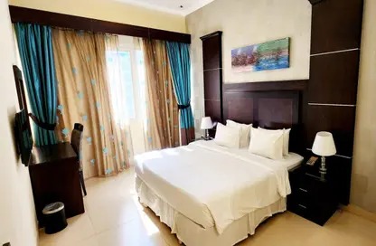 Room / Bedroom image for: Apartment - 1 Bedroom - 2 Bathrooms for rent in Al Barsha 1 - Al Barsha - Dubai, Image 1