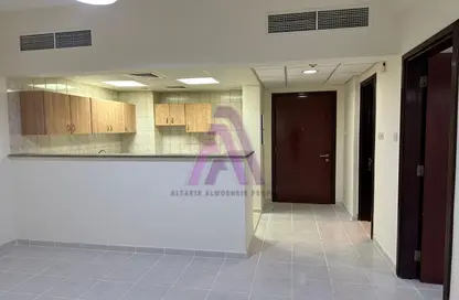 Kitchen image for: Apartment - 1 Bedroom - 2 Bathrooms for rent in P21 - France Cluster - International City - Dubai, Image 1