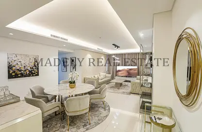 Living / Dining Room image for: Apartment - 3 Bedrooms - 3 Bathrooms for sale in Paramount Tower Hotel  and  Residences - Business Bay - Dubai, Image 1