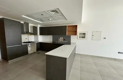 صورة لـ مطبخ شقة - غرفة نوم - 2 حمامات للايجار في بانثيون ايليسي - قرية الجميرا سركل - دبي ، صورة رقم 1