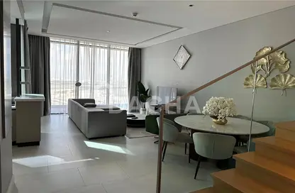 Living / Dining Room image for: Duplex - 2 Bedrooms - 3 Bathrooms for rent in SLS Dubai Hotel  and  Residences - Business Bay - Dubai, Image 1