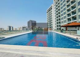 Pool image for: Studio - 1 bathroom for rent in Wavez Residence - Liwan - Dubai Land - Dubai, Image 1