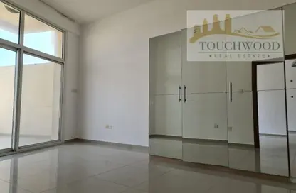 Empty Room image for: Apartment - 1 Bedroom - 2 Bathrooms for rent in Madison Residences - Majan - Dubai, Image 1