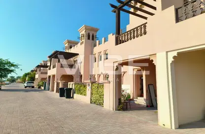 Outdoor Building image for: Townhouse - 4 Bedrooms - 3 Bathrooms for sale in The Townhouses at Al Hamra Village - Al Hamra Village - Ras Al Khaimah, Image 1