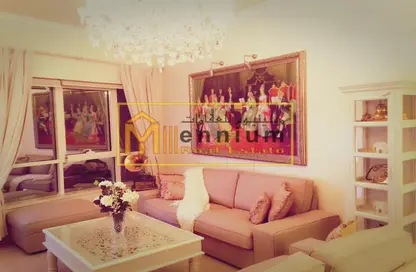 Living Room image for: Apartment - 1 Bedroom - 2 Bathrooms for sale in Queen Tower - Al Qasba - Sharjah, Image 1