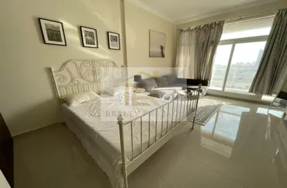Room / Bedroom image for: Apartment - 1 Bathroom for rent in Siraj Tower - Arjan - Dubai, Image 1