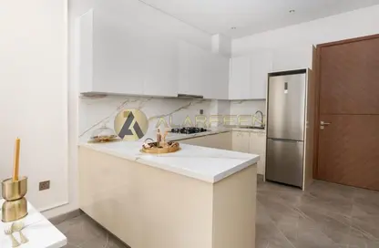 Kitchen image for: Apartment - 2 Bedrooms - 2 Bathrooms for sale in La Residenza - Jumeirah Village Circle - Dubai, Image 1