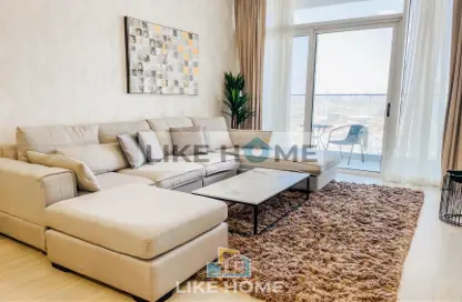 Living Room image for: Apartment - 1 Bedroom - 2 Bathrooms for rent in Bloom Heights B - Bloom Heights - Jumeirah Village Circle - Dubai, Image 1