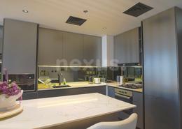 صورةمطبخ لـ: شقة - 1 غرفة نوم - 2 حمامات للبيع في أو تن - الجداف - دبي, صورة 1