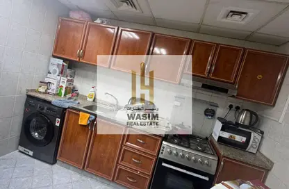 شقة - غرفة نوم - 2 حمامات للايجار في أورينت تاور 2 - أورينت تاور - البستان - عجمان