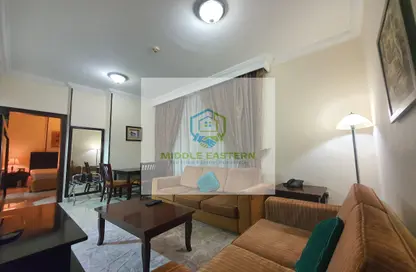 Living Room image for: Apartment - 1 Bedroom - 2 Bathrooms for rent in Muroor Area - Abu Dhabi, Image 1