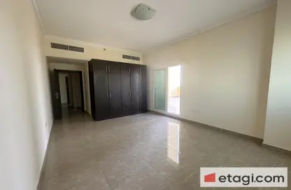 Empty Room image for: Apartment - 2 Bedrooms - 2 Bathrooms for sale in 7 Seasons building - Phase 2 - International City - Dubai, Image 1
