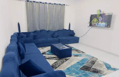 Living Room image for: Apartment - 1 Bedroom - 2 Bathrooms for rent in The Icon Casa 2 - Al Rashidiya 3 - Al Rashidiya - Ajman, Image 1