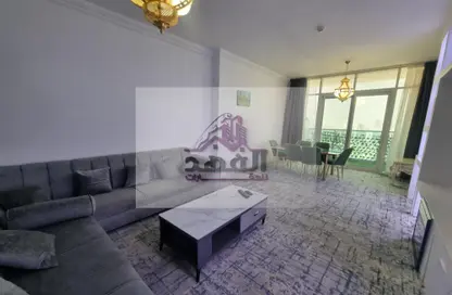 Living / Dining Room image for: Apartment - 2 Bedrooms - 2 Bathrooms for rent in Oasis Tower - Al Rashidiya 1 - Al Rashidiya - Ajman, Image 1