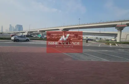 مستودع - استوديو - 4 حمامات للايجار في الكرامة - دبي