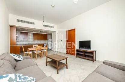 Living / Dining Room image for: Apartment - 1 Bedroom - 2 Bathrooms for sale in Sherlock House 1 - Sherlock House - Motor City - Dubai, Image 1