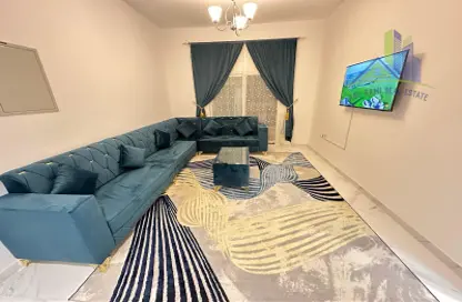 Living Room image for: Apartment - 1 Bedroom - 2 Bathrooms for rent in Al Nafoora 1 building - Al Rawda 2 - Al Rawda - Ajman, Image 1
