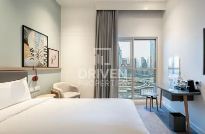 Room / Bedroom image for: Hotel  and  Hotel Apartment - 1 Bathroom for sale in Rove City Walk - City Walk - Dubai, Image 1