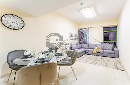Living / Dining Room image for: Apartment - 1 Bedroom - 2 Bathrooms for sale in Eden Garden - Dubai Sports City - Dubai, Image 1
