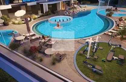 Pool image for: Apartment - 1 Bedroom - 2 Bathrooms for sale in Samana Manhattan 2 - Jumeirah Village Circle - Dubai, Image 1