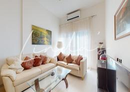 Living Room image for: Apartment - 2 bedrooms - 3 bathrooms for sale in Stadium Point - Dubai Sports City - Dubai, Image 1