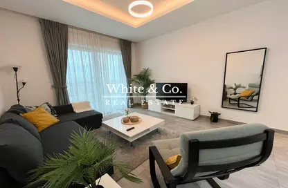 Living Room image for: Apartment - 1 Bedroom - 2 Bathrooms for rent in Alpha Green Tower - Jumeirah Village Circle - Dubai, Image 1