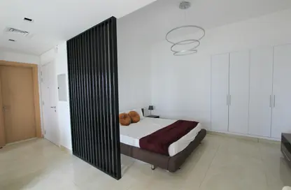 Room / Bedroom image for: Apartment - 1 Bathroom for rent in The Square Tower - Jumeirah Village Circle - Dubai, Image 1