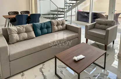 Living / Dining Room image for: Duplex - 2 Bedrooms - 3 Bathrooms for rent in Oasis 2 - Oasis Residences - Masdar City - Abu Dhabi, Image 1
