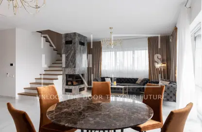 Living / Dining Room image for: Townhouse - 2 Bedrooms - 3 Bathrooms for sale in Reportage Village 1 - Dubai Land - Dubai, Image 1