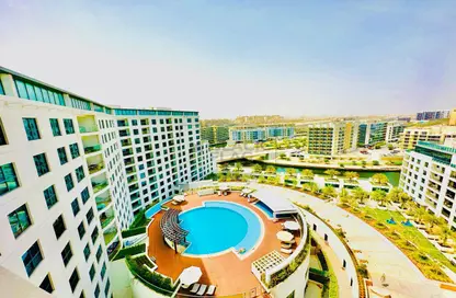 صورة لـ حوض سباحة شقة - 2 غرف نوم - 4 حمامات للايجار في الفريدة - شاطئ الراحة - أبوظبي ، صورة رقم 1