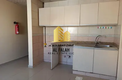 صورة لـ مطبخ شقة - 1 حمام للايجار في ميدان الرولة - منطقة الرولة - الشارقة ، صورة رقم 1
