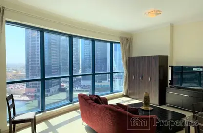 Living Room image for: Apartment - 1 Bathroom for rent in Jumeirah Bay X1 - Jumeirah Bay Towers - Jumeirah Lake Towers - Dubai, Image 1