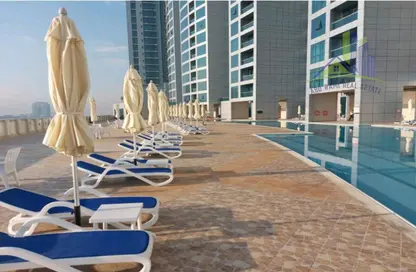 Pool image for: Apartment - 1 Bedroom - 3 Bathrooms for rent in Corniche Tower - Ajman Corniche Road - Ajman, Image 1