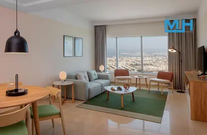 Living / Dining Room image for: Hotel  and  Hotel Apartment - 2 Bedrooms - 3 Bathrooms for rent in StayBridge Suites - Sheikh Zayed Road - Dubai, Image 1