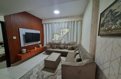 Living Room image for: Apartment - 1 Bedroom - 1 Bathroom for sale in Almond Tower - Garden City - Ajman, Image 1