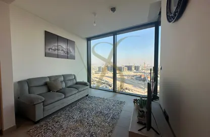 Living Room image for: Apartment - 1 Bedroom - 2 Bathrooms for rent in Sobha Hartland Waves - Sobha Hartland - Mohammed Bin Rashid City - Dubai, Image 1